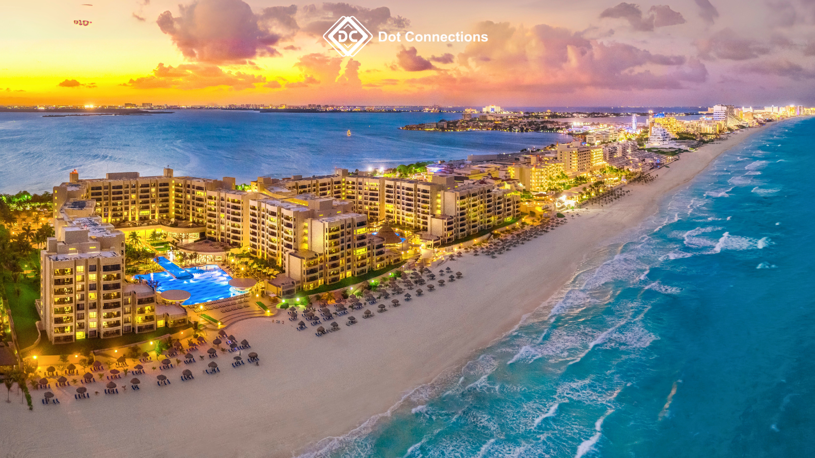 Aerial view of beachfront luxury resorts in Thailand at dusk, lit up with colorful lights, representing proposed integrated casino resorts aimed at boosting tourism.