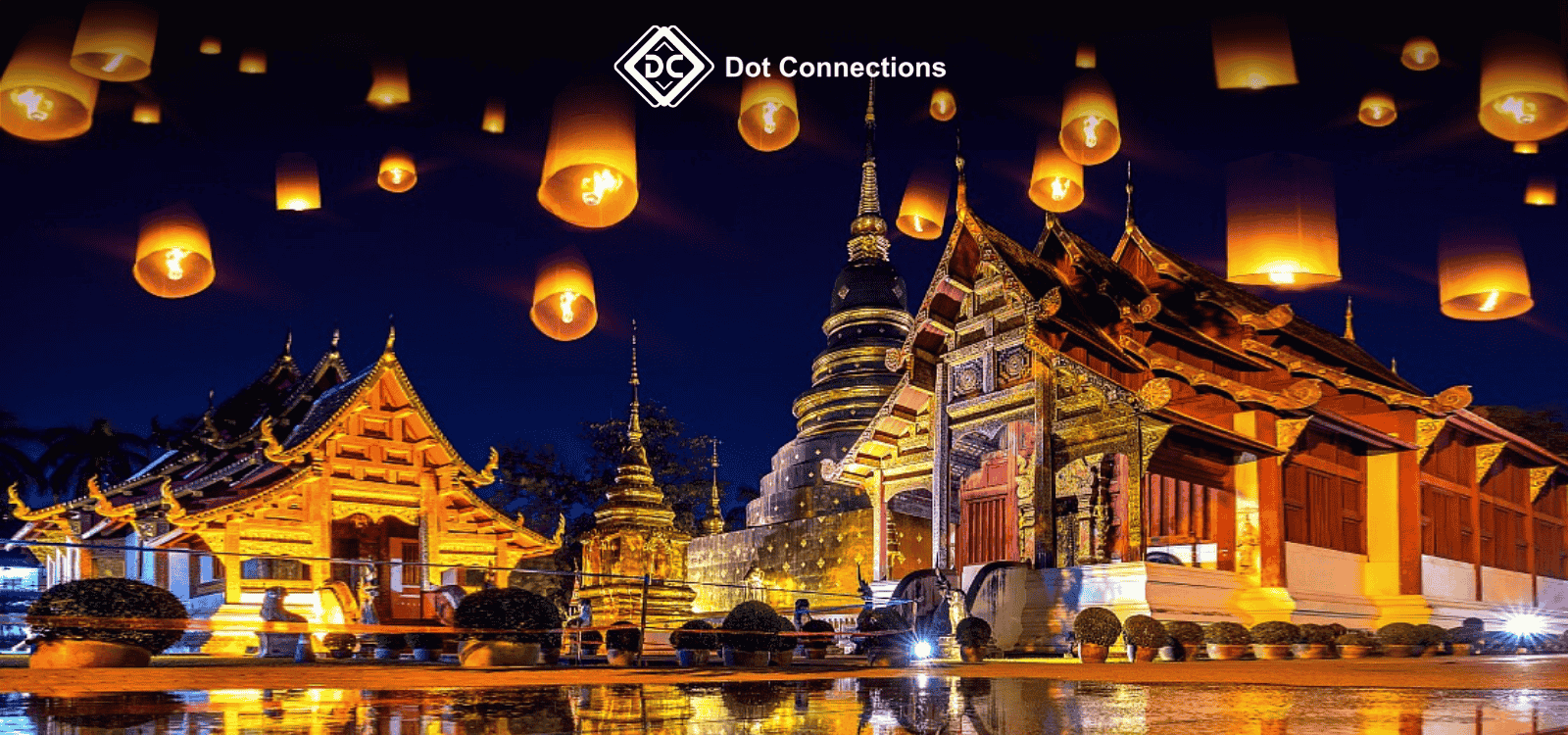 Lanterns floating in the night sky above a traditional Thai temple, symbolizing Thailand’s cultural identity and heritage.