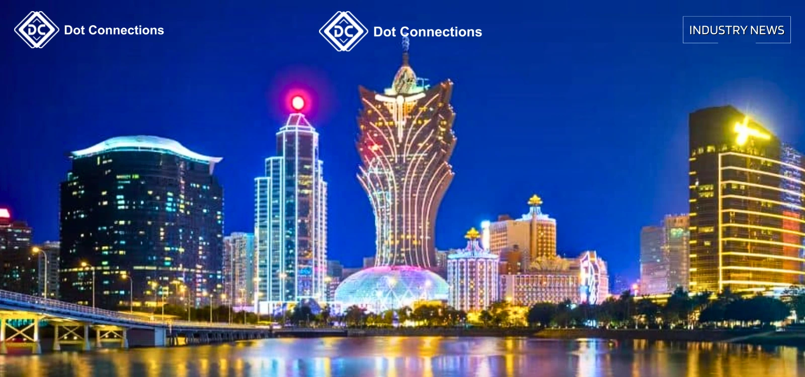 Macau skyline at night reflected on the water with illuminated resort towers
