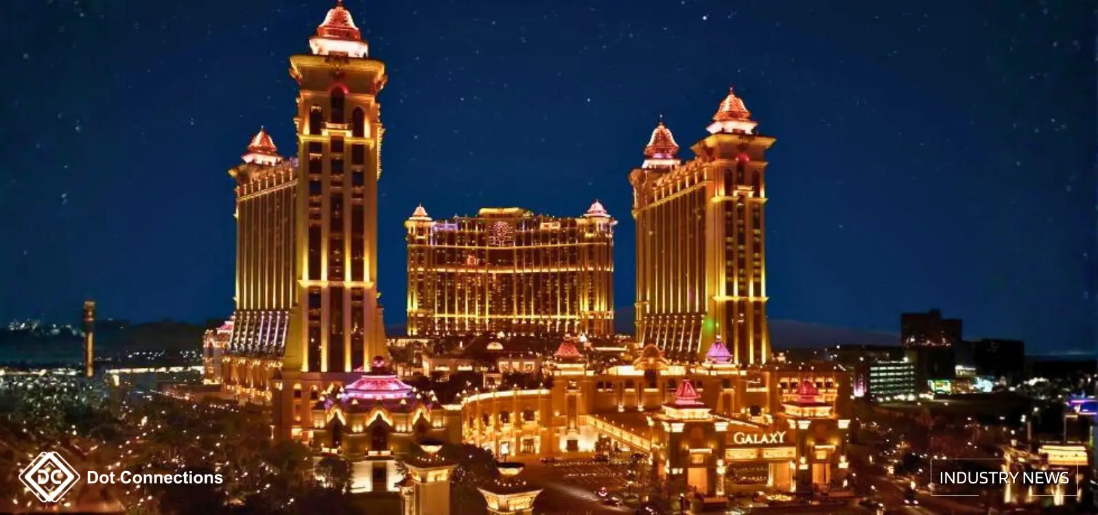 Night skyline of Macau’s Cotai Strip with illuminated integrated-resort towers reflected on the water.