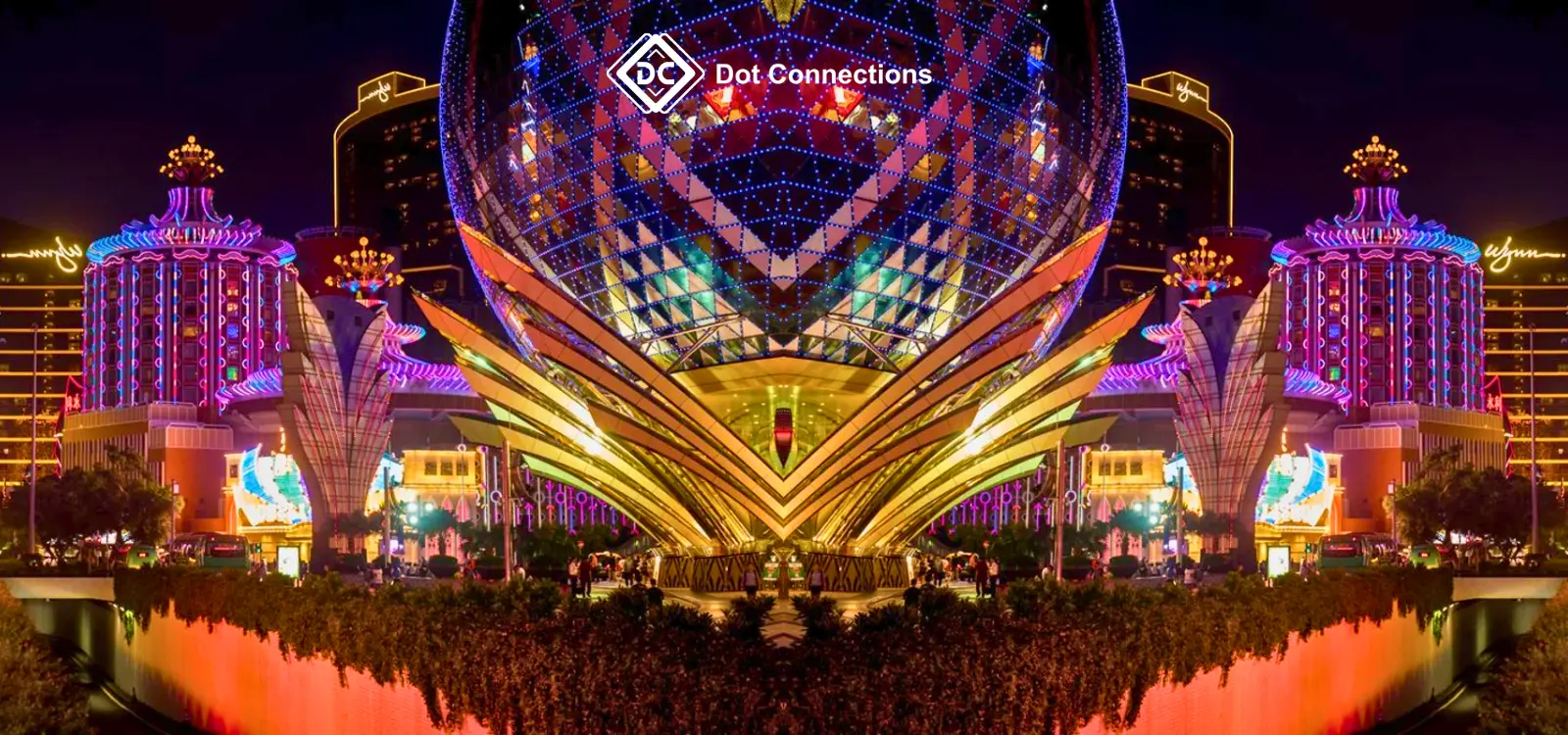 Colorful night view of a major Macau casino complex with Dot Connections branding, used to illustrate Macau market momentum in 2026.